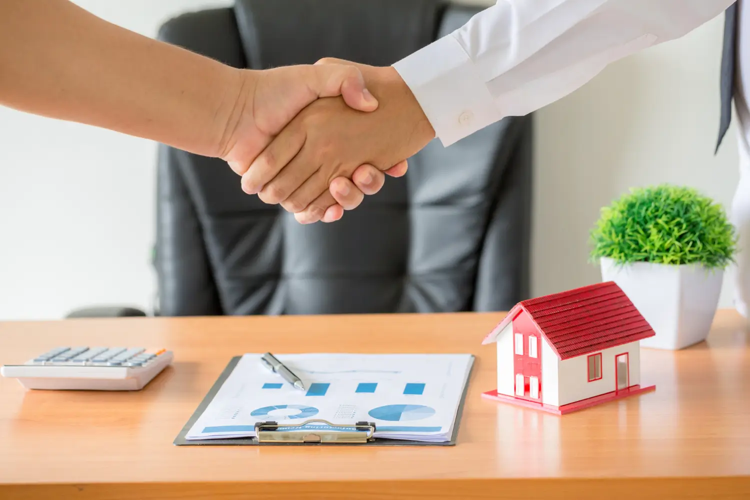 man shake hand and show trust as a trusted property dealer